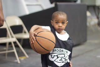 Young Brooklyn USA Basketball player with basketball