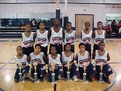 Brooklyn USA Basketball youth team with trophies